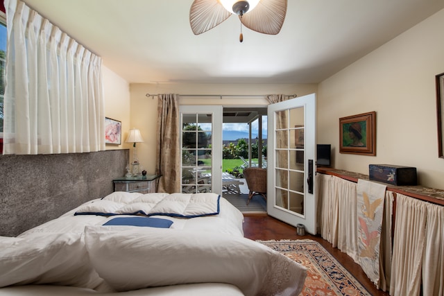 bedroom featuring access to exterior, dark wood-type flooring, and ceiling fan