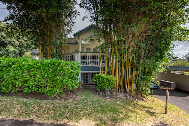 view of property hidden behind natural elements