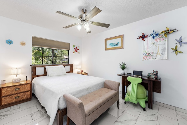 bedroom featuring a ceiling fan and marble finish floor