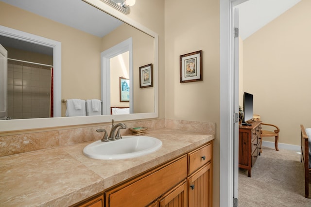 bathroom featuring walk in shower and vanity