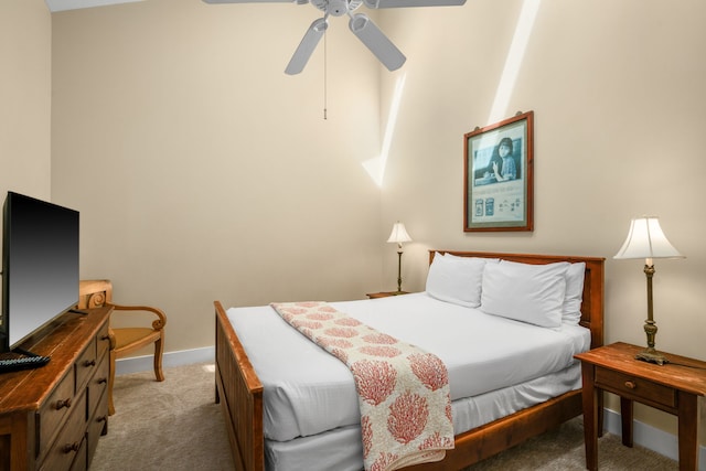 bedroom featuring ceiling fan and light carpet