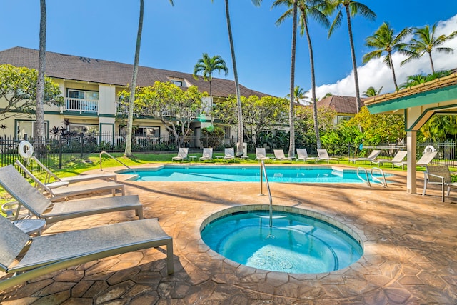 view of pool with a patio and a community hot tub