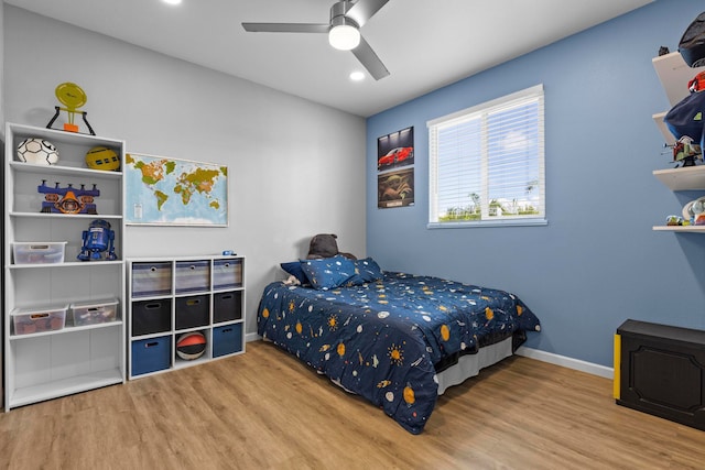 bedroom featuring ceiling fan and hardwood / wood-style flooring