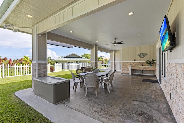 view of patio featuring ceiling fan