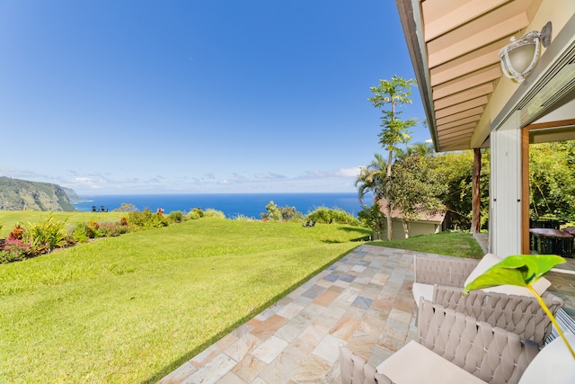 view of patio with a water view