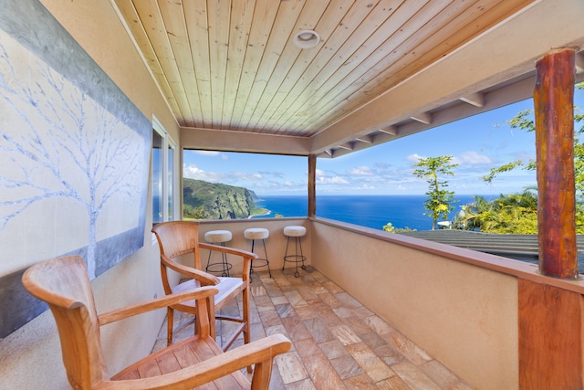 balcony featuring a water view