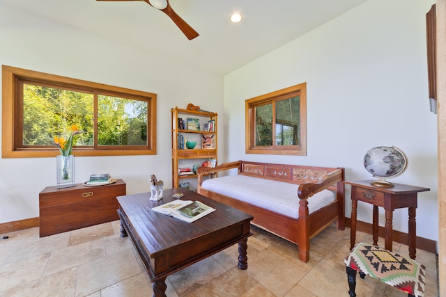 living area featuring ceiling fan