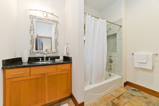 bathroom with shower / bath combo with shower curtain and vanity