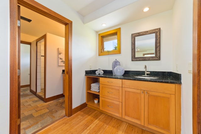 bathroom with vanity and hardwood / wood-style floors