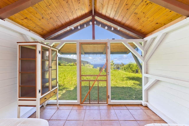 unfurnished sunroom featuring a wealth of natural light, vaulted ceiling, and wood ceiling