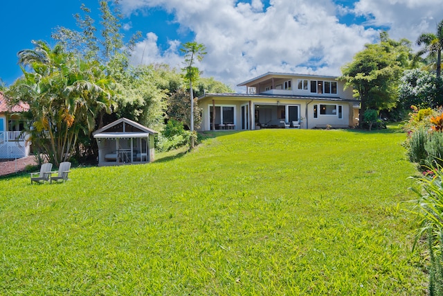 back of house with a yard