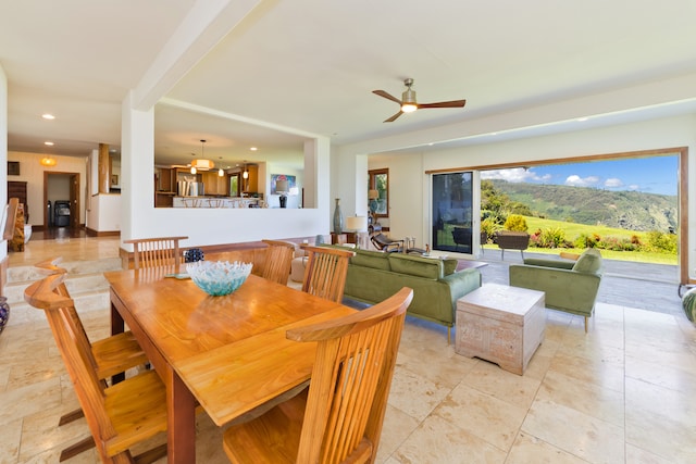 dining room featuring ceiling fan