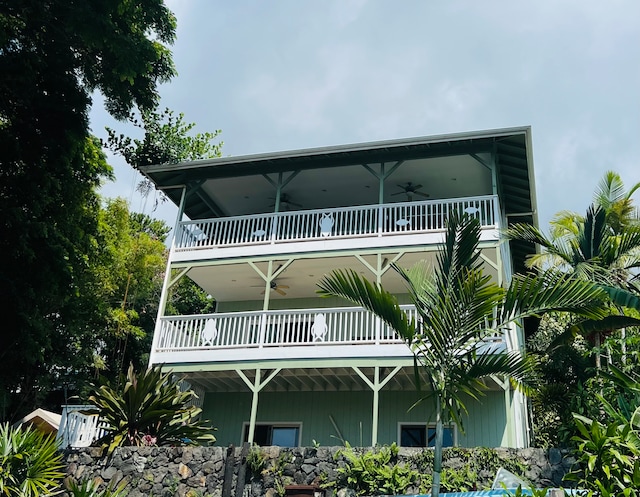 back of property with a balcony