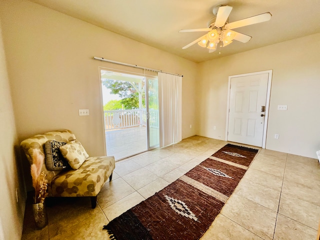 entrance foyer featuring ceiling fan and light tile patterned floors