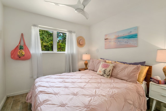 3707 Omao Rd, Koloa, HI 96756 - bedroom featuring wood finished floors, a ceiling fan, and baseboards