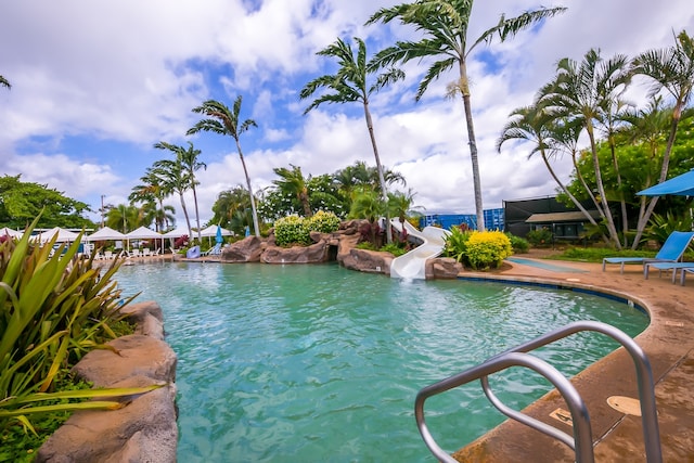 view of pool with a water slide