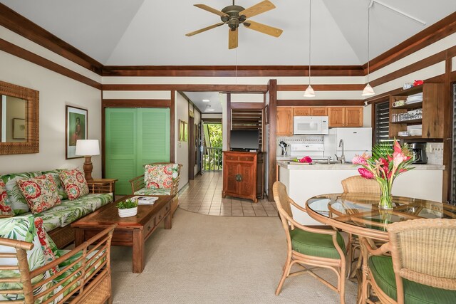 living room featuring ceiling fan, light tile patterned floors, and high vaulted ceiling