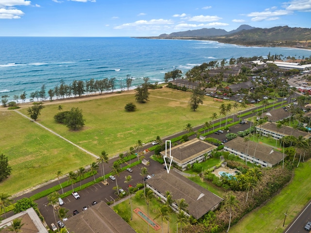 drone / aerial view featuring a water and mountain view