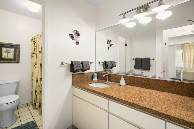 bathroom featuring cooling unit, tile patterned flooring, vanity, and toilet