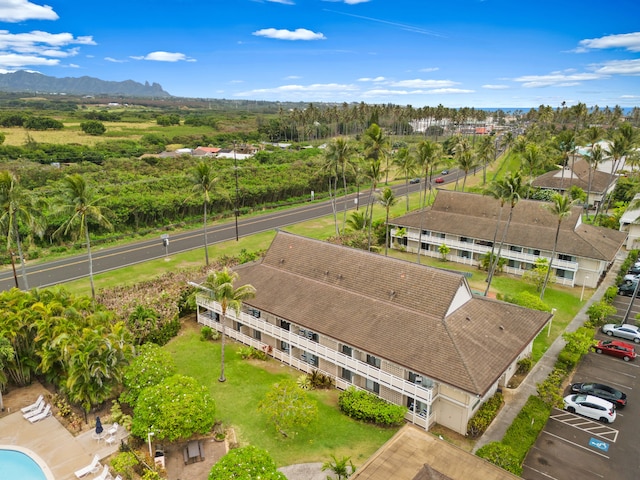 birds eye view of property with a mountain view