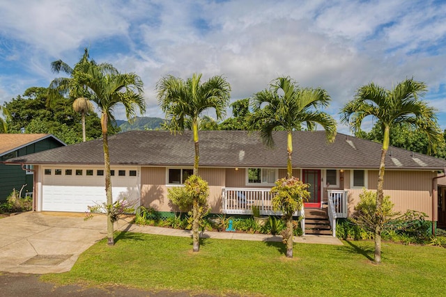 single story home featuring a front yard and a garage