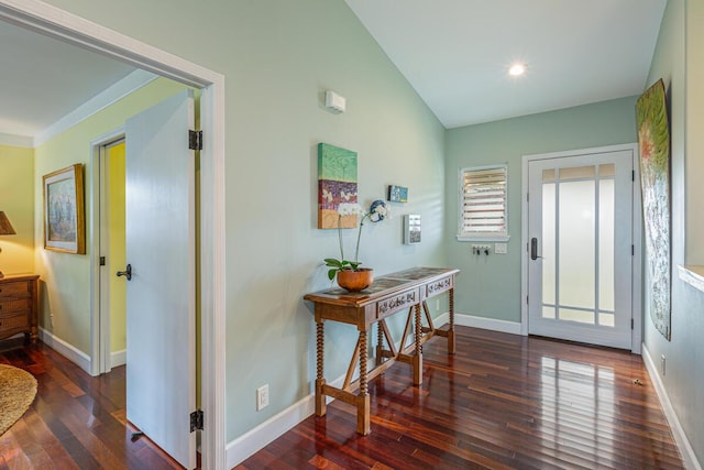 foyer entrance featuring dark hardwood / wood-style flooring and vaulted ceiling