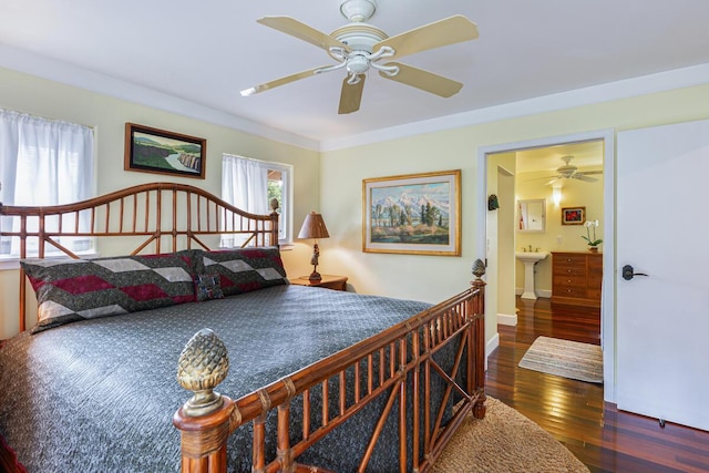 bedroom with ensuite bathroom, sink, crown molding, dark hardwood / wood-style floors, and ceiling fan