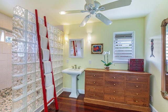 bathroom featuring hardwood / wood-style floors, ceiling fan, and walk in shower