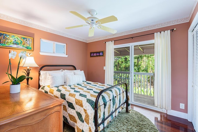 bedroom with access to exterior, ceiling fan, crown molding, a closet, and hardwood / wood-style flooring