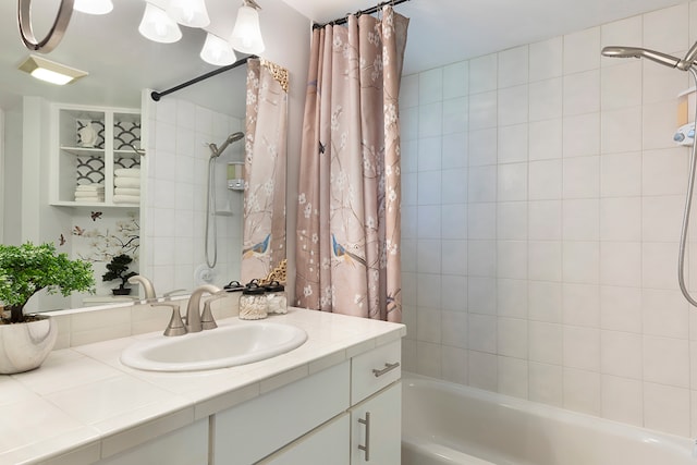 bathroom featuring shower / bathtub combination with curtain and vanity