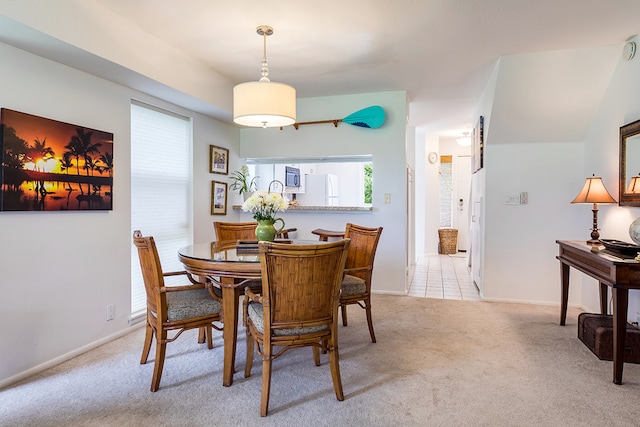 dining area with light colored carpet