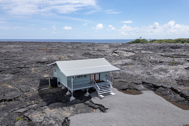 exterior space with a water view