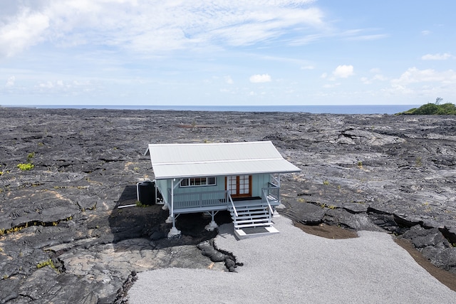 exterior space with a water view