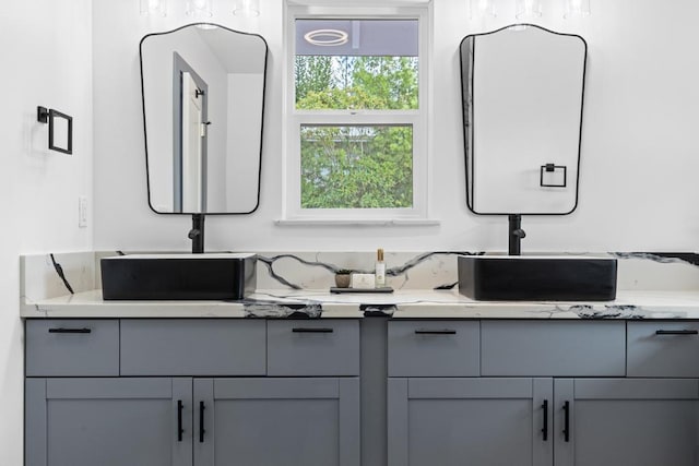 bathroom featuring double vanity and a sink