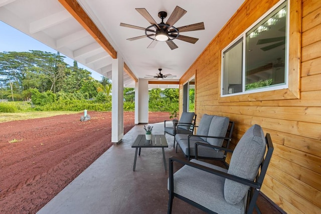 view of patio with ceiling fan and outdoor lounge area