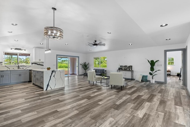 interior space featuring recessed lighting, vaulted ceiling, and a healthy amount of sunlight