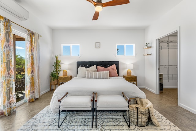 bedroom featuring a wall mounted AC, a walk in closet, ceiling fan, multiple windows, and a closet