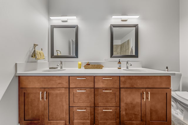 bathroom featuring vanity and toilet