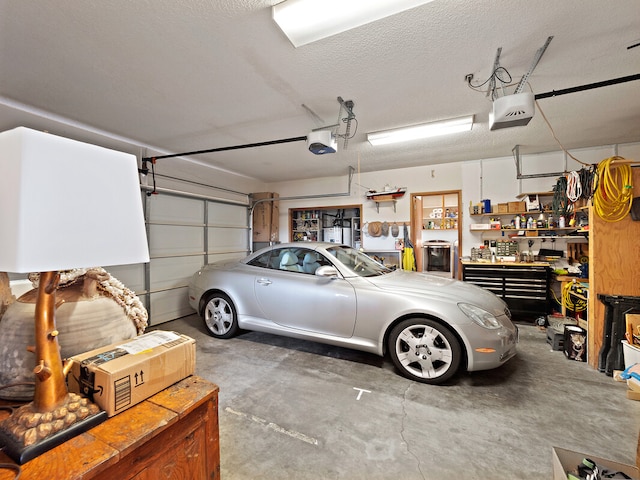 garage with a garage door opener and a workshop area