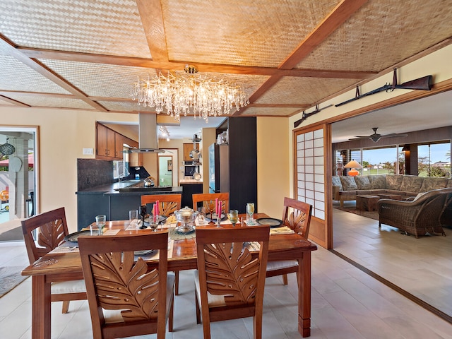 tiled dining space with beamed ceiling, coffered ceiling, and a chandelier