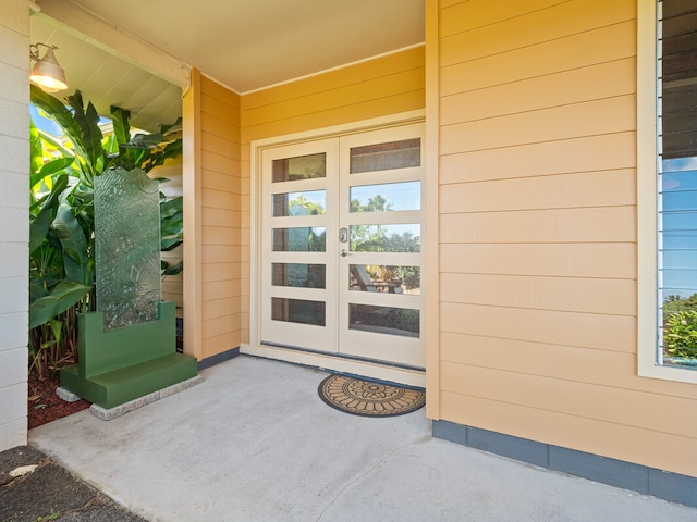 view of exterior entry featuring french doors