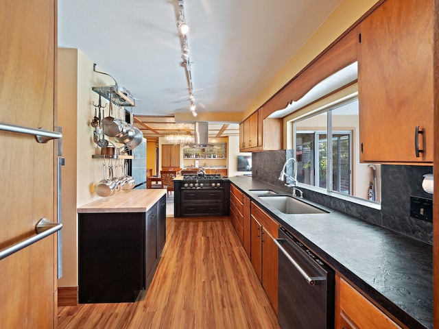 kitchen with sink, stainless steel dishwasher, island range hood, light hardwood / wood-style floors, and decorative backsplash