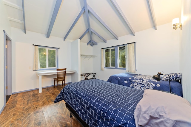 bedroom featuring lofted ceiling with beams, a closet, and multiple windows