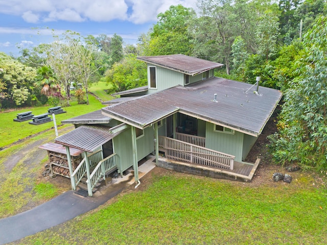 view of front of home with covered porch and a front yard