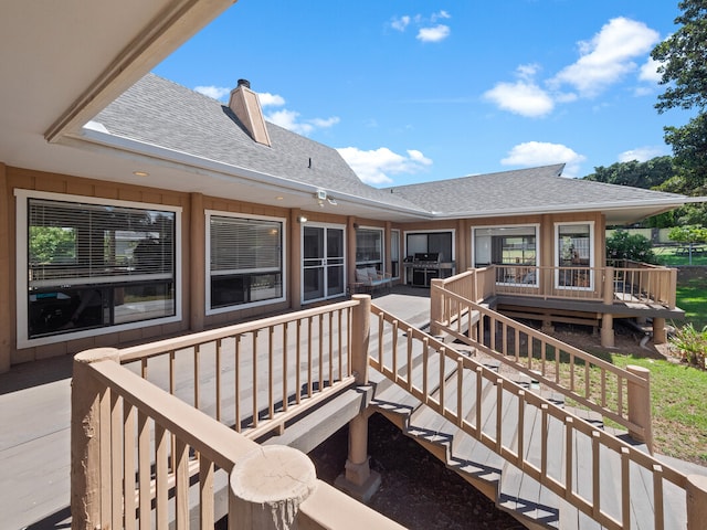 back of property featuring a deck