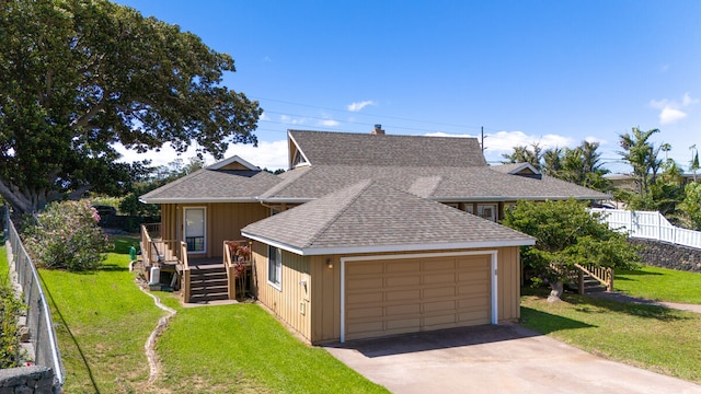 view of front facade with a front lawn and a garage