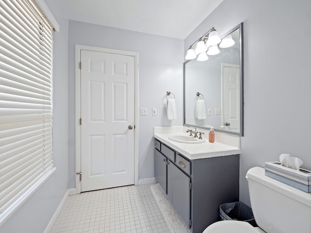 bathroom featuring vanity, toilet, and tile patterned floors