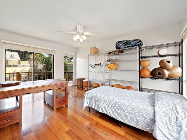 bedroom with wood-type flooring and ceiling fan