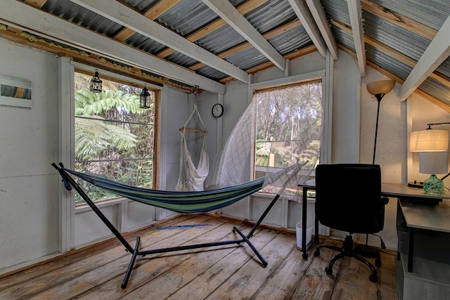 office area featuring lofted ceiling with beams, a wealth of natural light, and light hardwood / wood-style floors