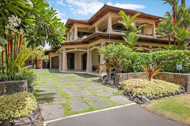 rear view of house featuring a patio